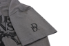 Close-up of the gray shirt's left sleeve, with a small DD logo in black