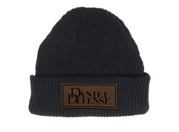 Black Woven beanie with a brown square on the bottom front side, written Daniel Defense embroided in black.