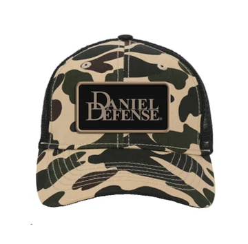 Image of a camo hat with a black and tan Daniel Defense patch on the front