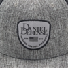 Gray and black hat with light-gray Daniel Defense patch on the front center