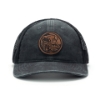 Distressed black hat with a black mesh back and a leather patch with a park scene and a flag and a Daniel Defense logo