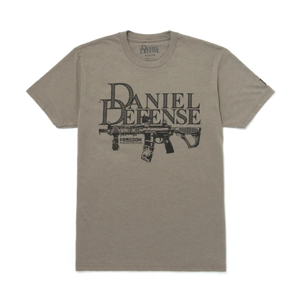 Gray t-shirt written Daniel Defense in black over the chest area, with a firearms image under it