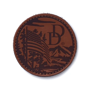 Brown patch with the Daniel Defense logo and American flag