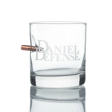 BenShot whiskey glass with a Daniel Defense logo laser engraved on the front with a bullet going through the glass