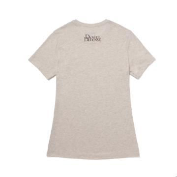 A light tan t-shirt with the text "Daniel Defense" printed in a script font across the chest. Below the name, the phrase "THE SECOND DEFENDS THE REST" is printed in smaller letters.